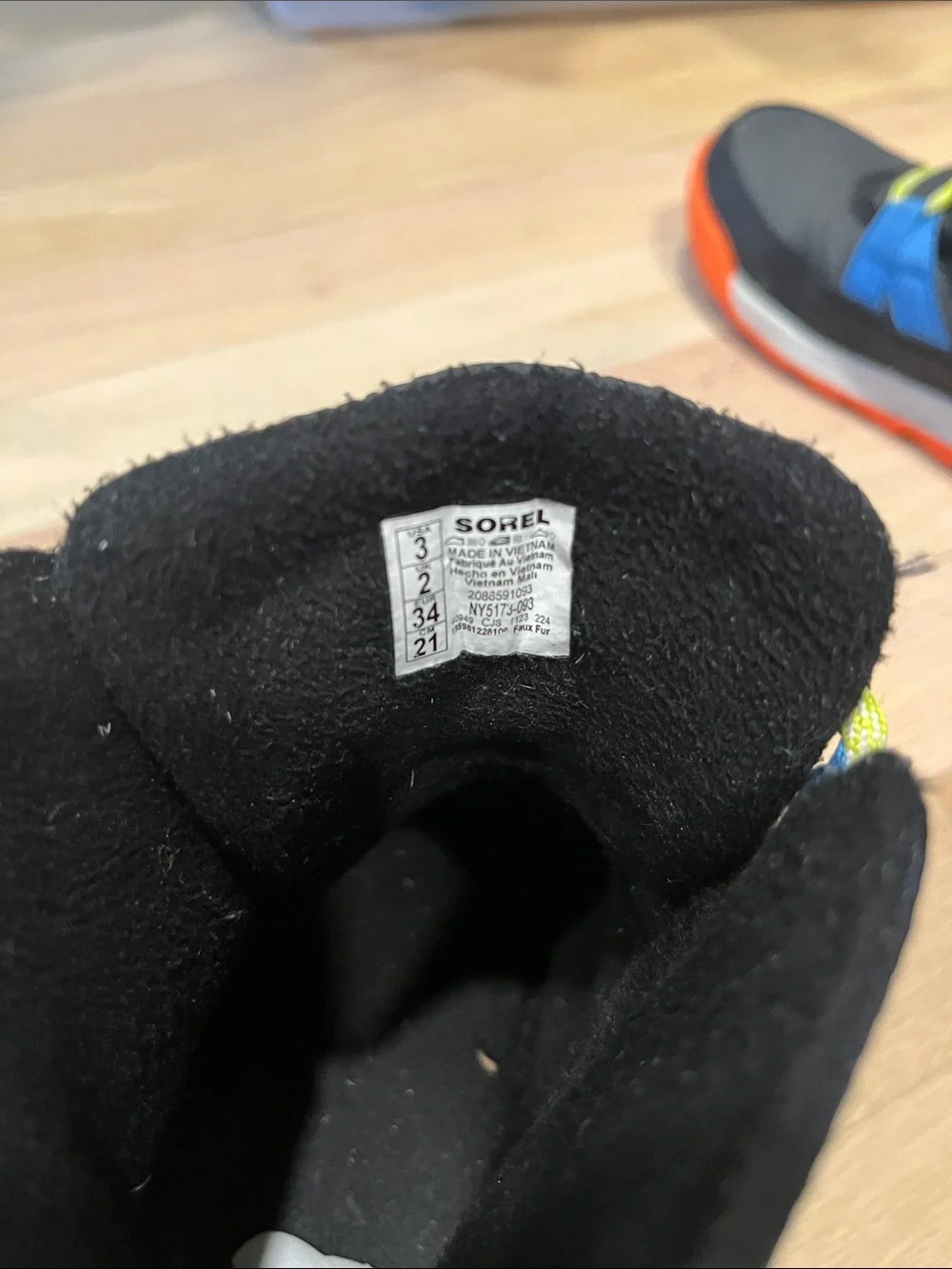 Sorel Kids Black Boots with Blue Stripes and Orange Sole